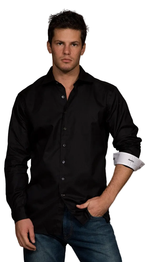 Man wearing a black button-up shirt with rolled-up sleeves on a white background